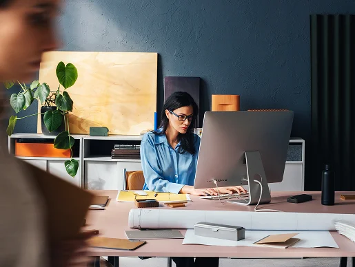 Woman writing on her computer