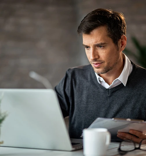 Man writing on a computer